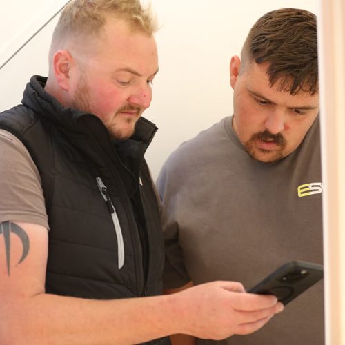 ESW team members reviewing plans on tablet