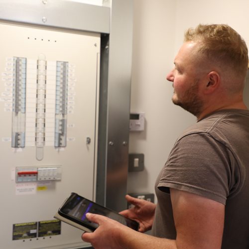 ESW electrician checking a distribution board