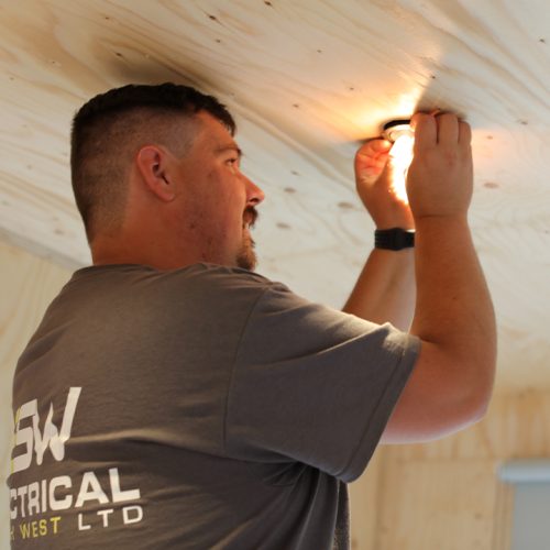 Electrician fitting a light Electrician fitting a light