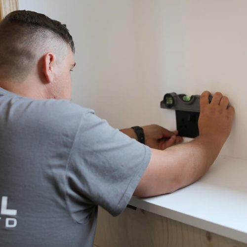 Electrician marking out a socket