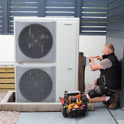 Electrician working on heat pump Electrician working on heat pump