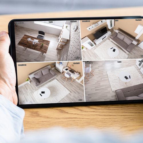Person using app on a tablet to view CCTV camera feed